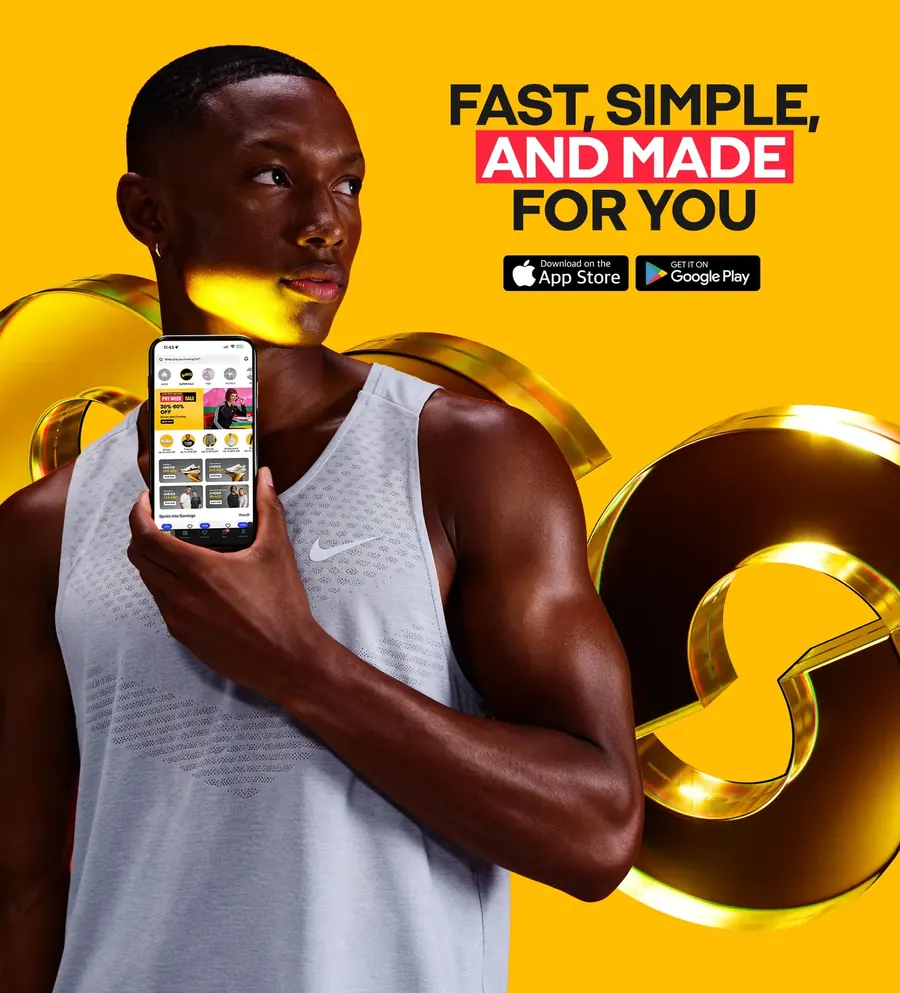 An athlete holding the app on the yellow stage