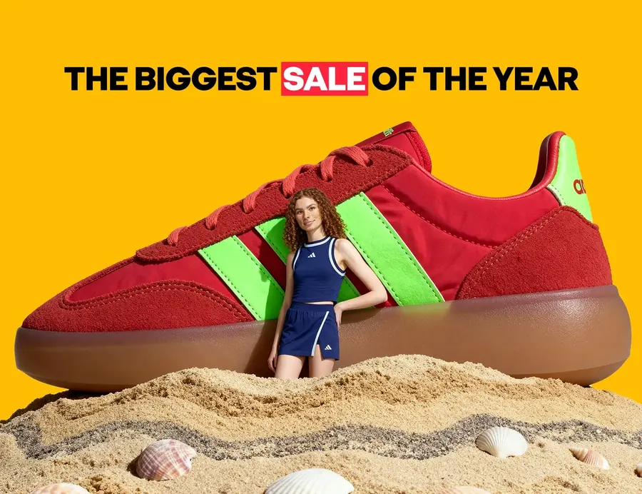 A giant red sneaker on sand, The biggest sale of the year